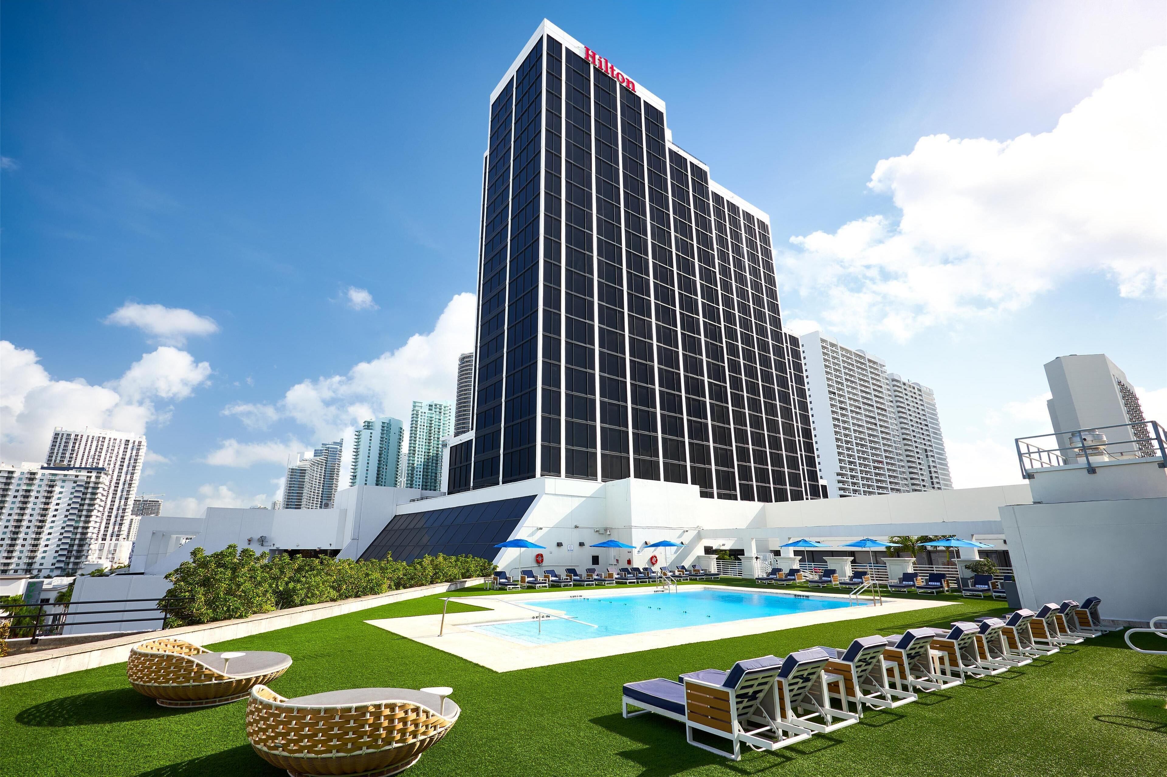 Pool terrace and hotel exterior at Hilton Miami Downtown