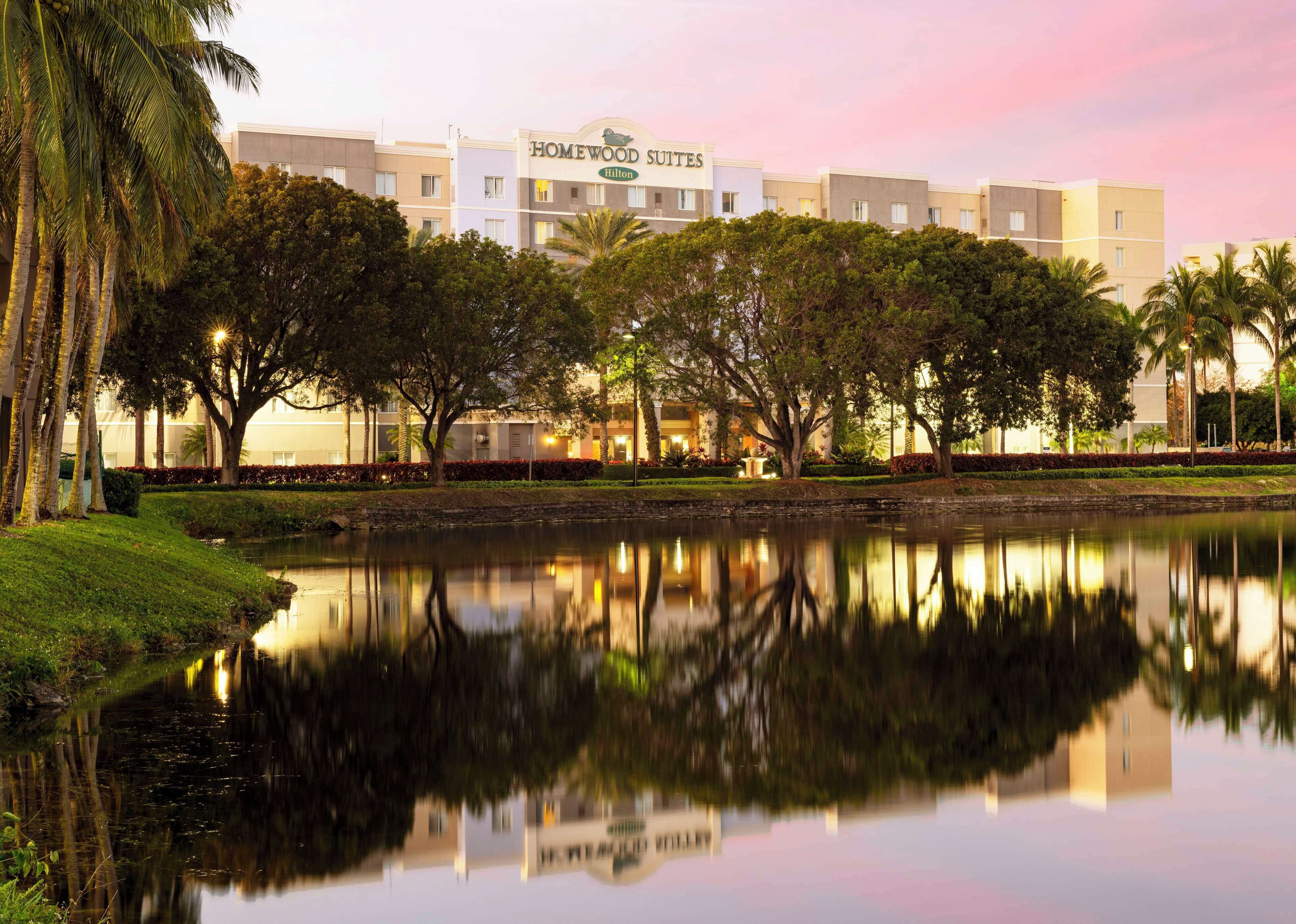 Hotel exterior beside the lagoon at Homewood Suites by Hilton Miami-Airport/Blue Lagoon